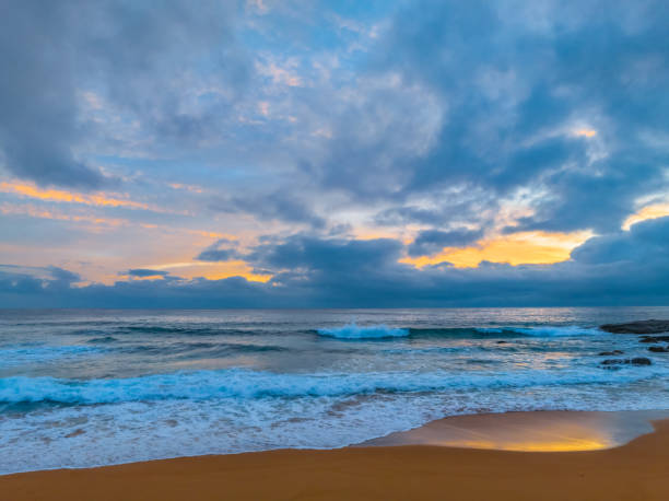 istock Northern Beaches Sunrise at the seaside with rain clouds 1873672866