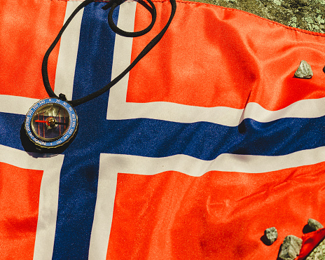 Compass on norwegian flag. Travel, tourism and exploration.