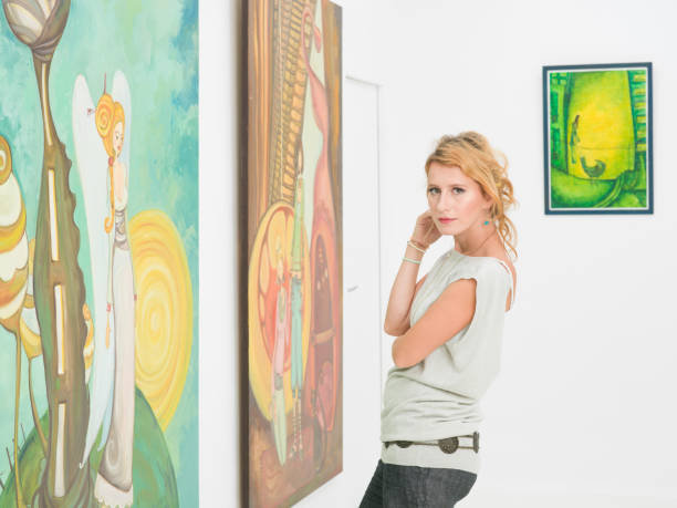 istock beautiful woman visiting an art gallery 187369409