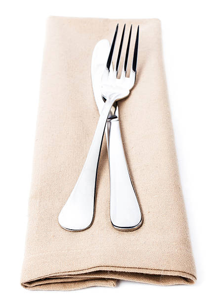 istock Linen napkin with cutlery - knife and fork  isolated 187371007