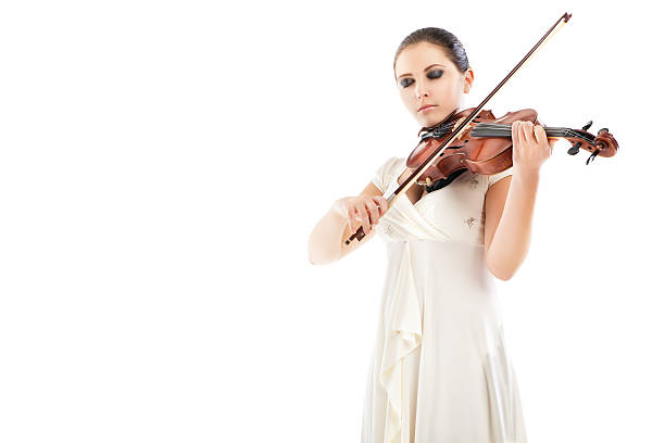 istock Beautiful young woman playing violin over white 187371422