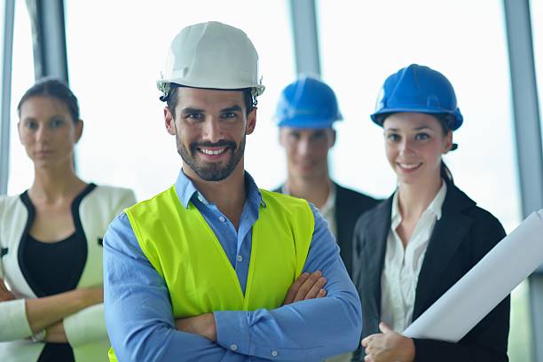 istock business people and engineers on meeting 187371962