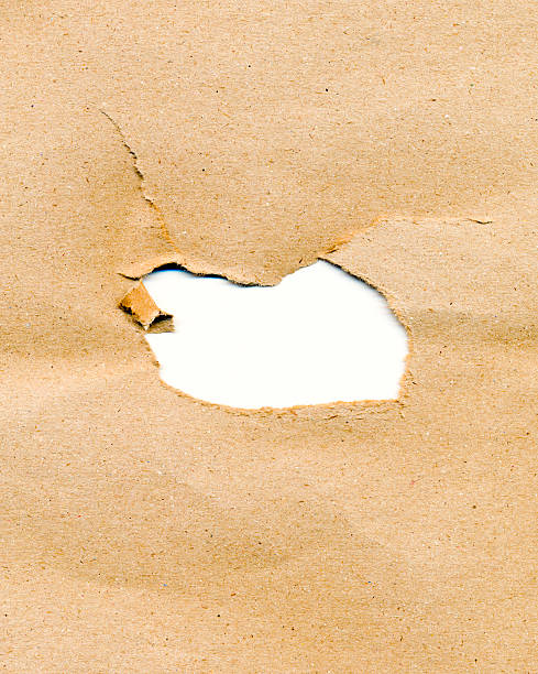 loch im papier - bullet hole exploding hole tearing stock-fotos und bilder