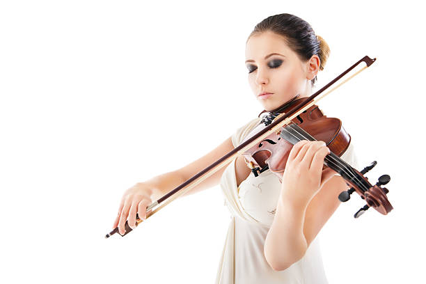 istock Beautiful young woman playing violin over white 187373022