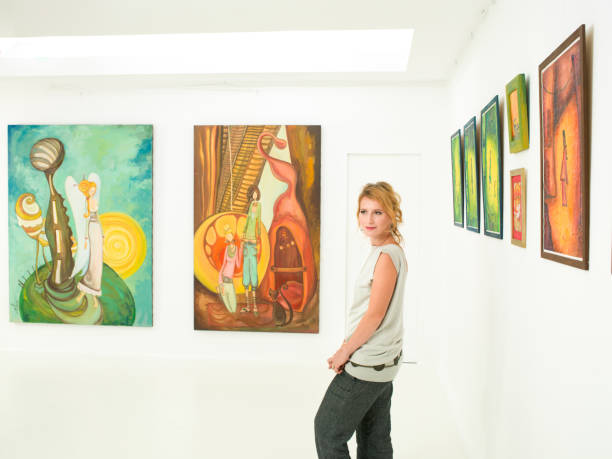 istock young woman visiting art exhibition 187375133
