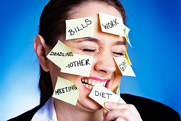 istock Embarrassed woman covered in task reminders giggles shyly 187375618