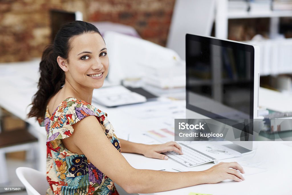 I love every minute of this job! Portrait of an attractive young designer at work on a computer Adult Stock Photo