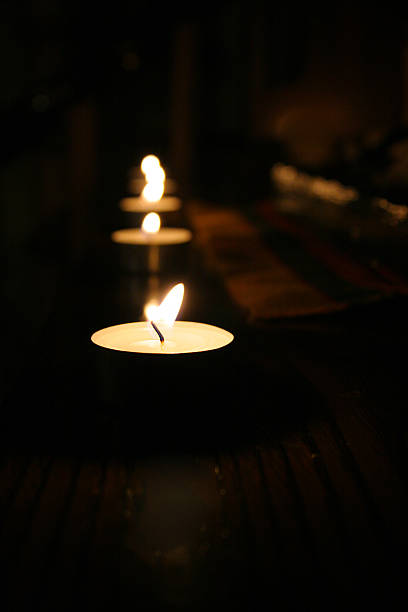 istock little candle in the dark 187375840