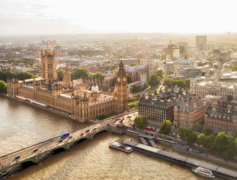 Two shot panoramic image of the Big Ben Clock Tower, houses of Parliament and the Westminster Bridge across the River Thames.  Image was taken from the Millennium Wheel or London Eye Ferris Wheel in the late afternoon.
