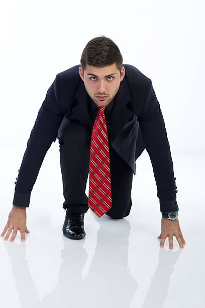 empresario en la posición inicial, aislado sobre un blanco - businessman starting block business sport fotografías e imágenes de stock