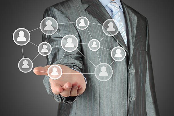 istock Businessman with hand holding virtual social media buttons 187376260