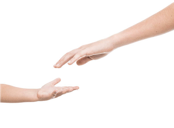 istock Adults hand reaching out for a Childs hand 187376593