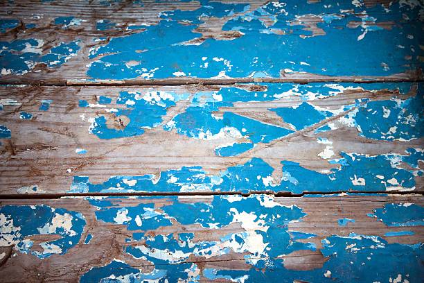 Old weathered blue wooden board background.