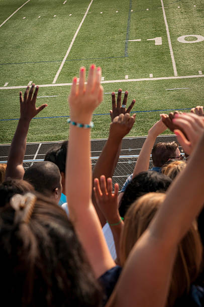 istock Fans with raised arms cheering for their team - II 187376793