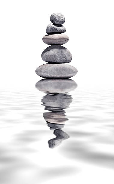 istock Volcanic peblles over water - Balance and wellbeing concepts 187379966