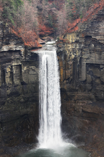 The main waterfall at Taughannock Falls State Park near the village of Trumansburg - just northwest of the city of Ithaca - in New York State, USA. Looking down from this angle, it's difficult to appreciate the extreme distance - 215 ft (65.5 m) - the water actually falls.