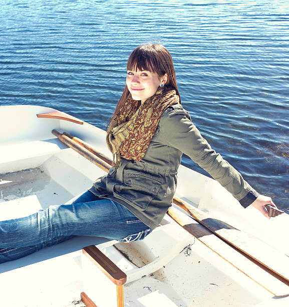 istock Beautiful Young Woman in a Rowboat. 187380372