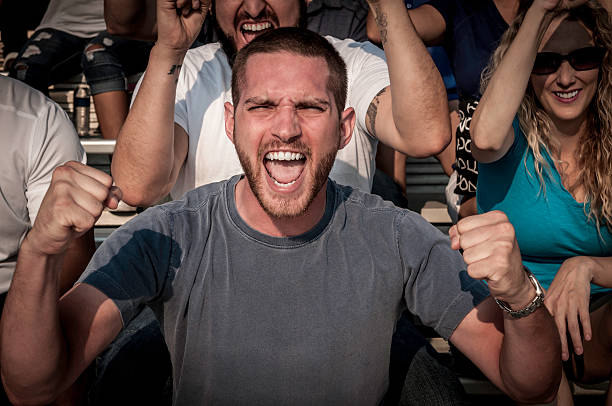 istock Excited young man cheering for his team 187382406