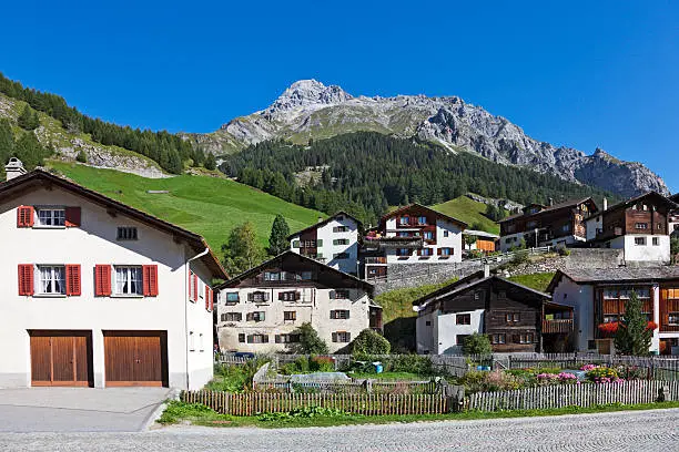 Houses with mountains in background in Splügen, Switzerland