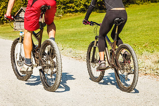 istock Couple on mountain bikes 187383720