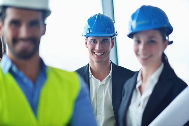 istock business people and engineers on meeting 187383799