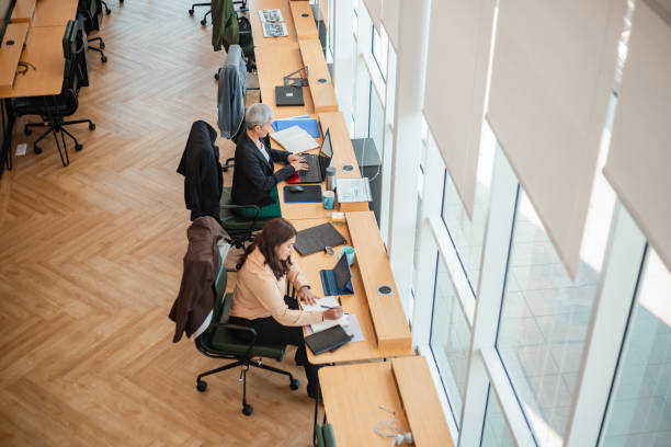 istock women working with laptops in co working space 1873839374
