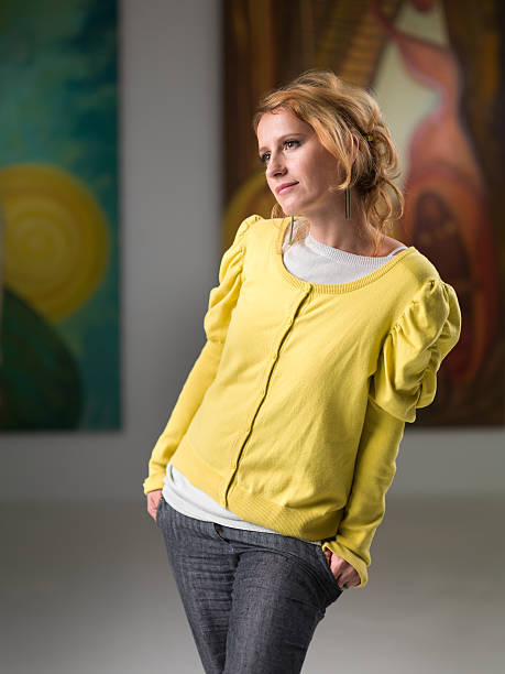 istock woman analyzing a painting in an art museum 187385511