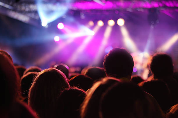 istock Crowd audience at music concert 187385883