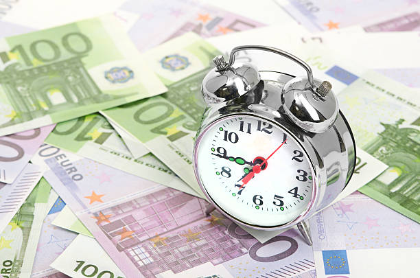 istock Alarm clock for euro banknotes 187385903