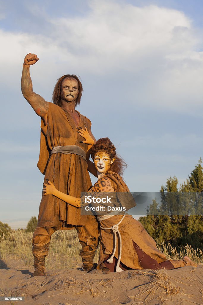 Cheetah and Lion People Cheetah Woman and Lion Man Looking at each other in the Desert (Stock Image) Anthropomorphic Stock Photo