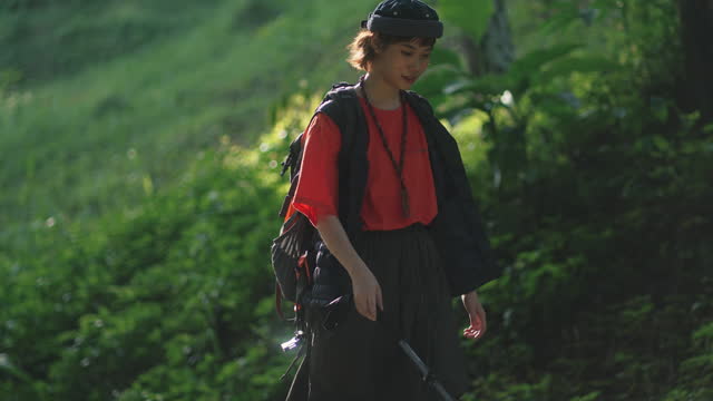 Asian Chinese young woman hiking during weekend morning