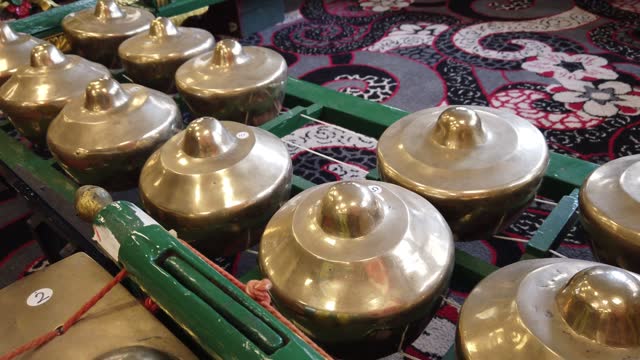 Javanese Gamelan Musical Instruments Bells and Bronze Gongs of Indonesia Closeup
