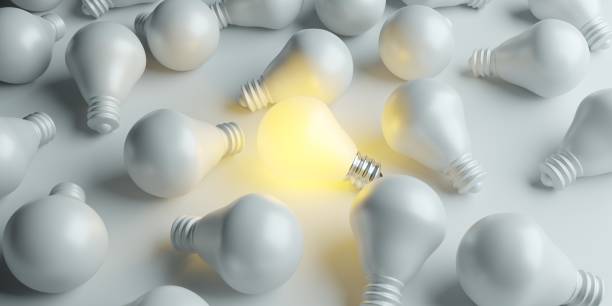 istock Illuminated light bulb standing Out in Crowd. Creative idea and inspire innovation 1873928406