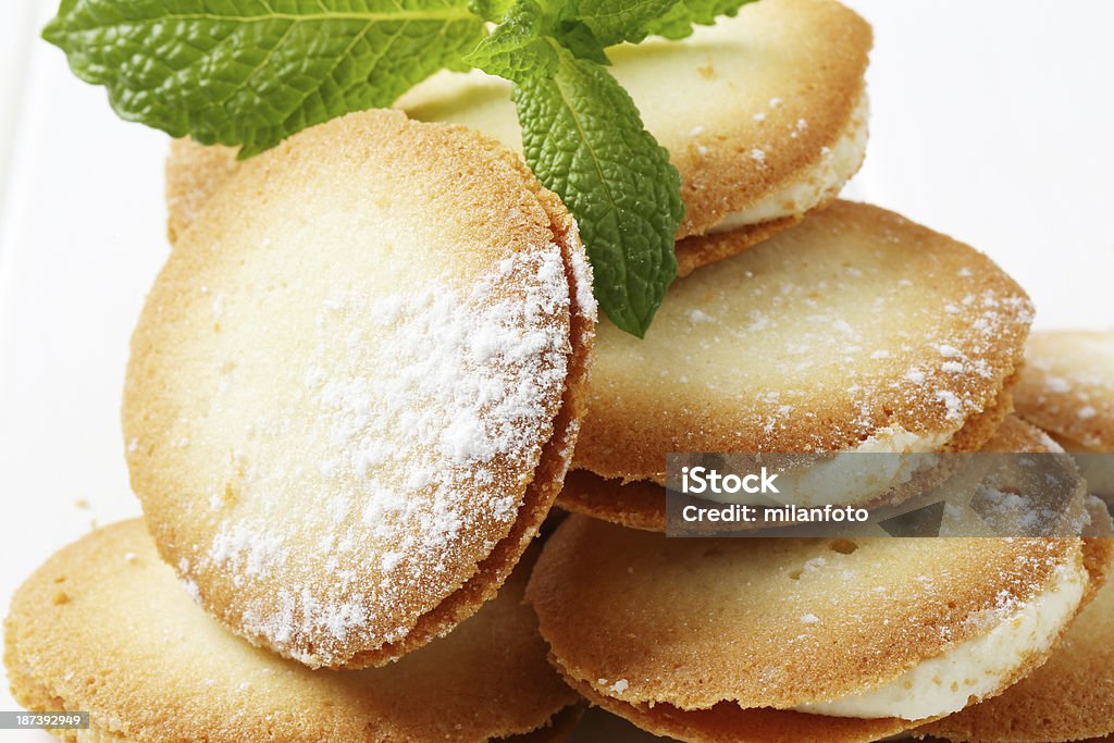 sandwich cookies detail of sandwich cookies with cream filling and fresh mint Baked Stock Photo