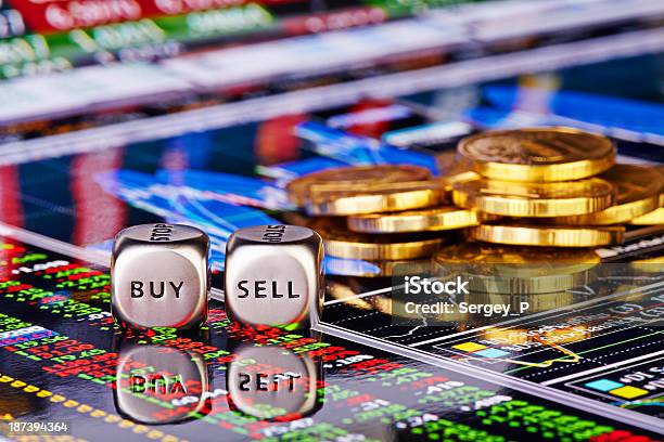 Dices Cubes With The Words Sell Buyand Golden Coins Stock Photo - Download Image Now