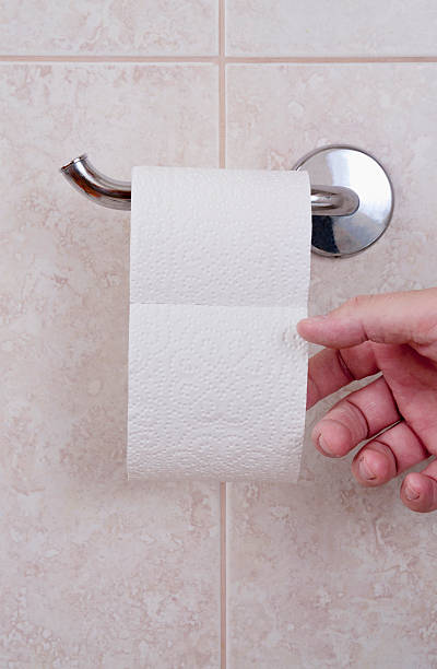 istock Toilet paper with hand 187394932