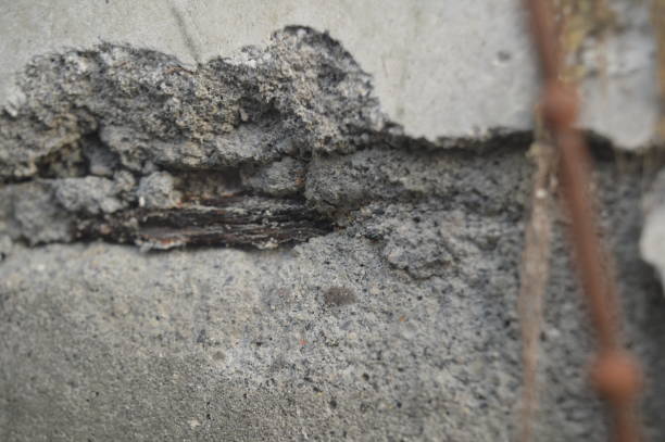 istock Selective focus, patterns, shapes and textures of an old damaged and holey wall. 1873950402
