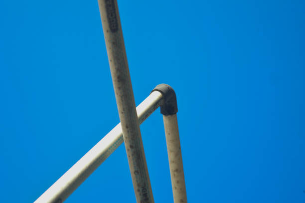 istock small size PVC pipe, installed in a water reservoir, blue sky background 1873969820