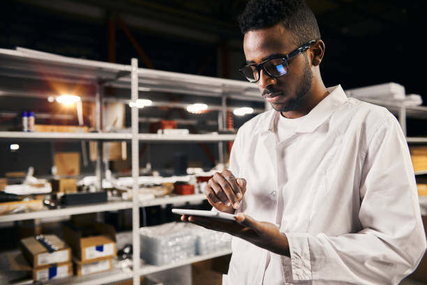 istock African engineer working with tablet at factory 1873973008