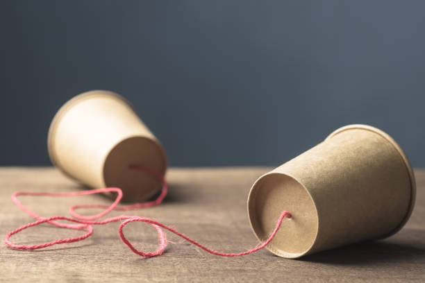istock Two brown paper cups toy phone 1874010126