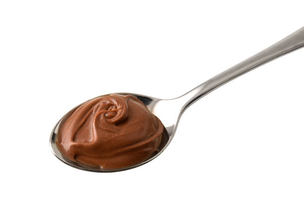 istock Spoon of chocolate cream front view white isolated top 1874036800