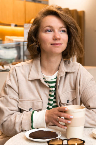istock Young woman portrait in cafe 1874060676