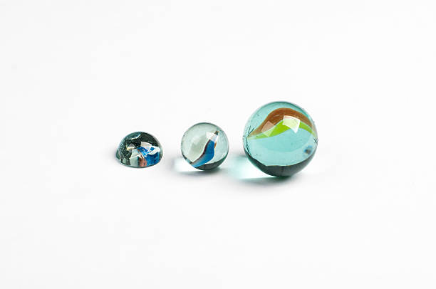 istock glass marbles on the white background 187407459