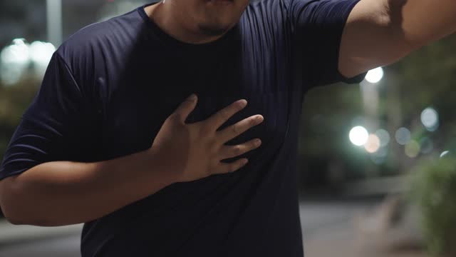Overweight man feeling chest pain and tired
