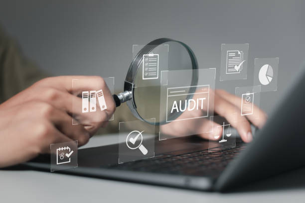 istock Businessman using laptop computer to audit and evaluate corporate financial statements for Audit business concept. Auditing financial accounts within the organization. 1874099766