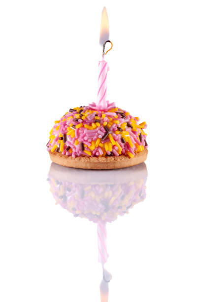 colorful birthday cake with candle isolated on white background - cupcake birthday birthday cake first place imagens e fotografias de stock