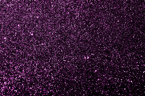 Purple Magenta Pink Violet Glitter Sparkle Light Shining Texture Background. Christmas, New Year and Celebration Background Concepts.
