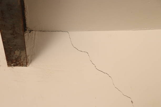 istock Small Cracks and damaged side of wall with iron ceiling frame 1874111337