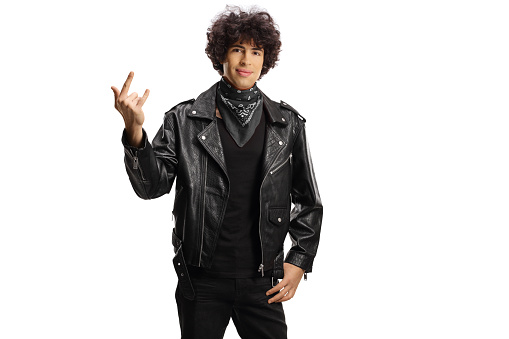 Man in a leather jacket and black scarf gesturing rock and roll sign isolated on white background