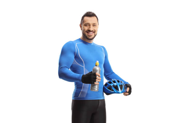 istock Male cyclist holding a helmet and a bottle 1874133342